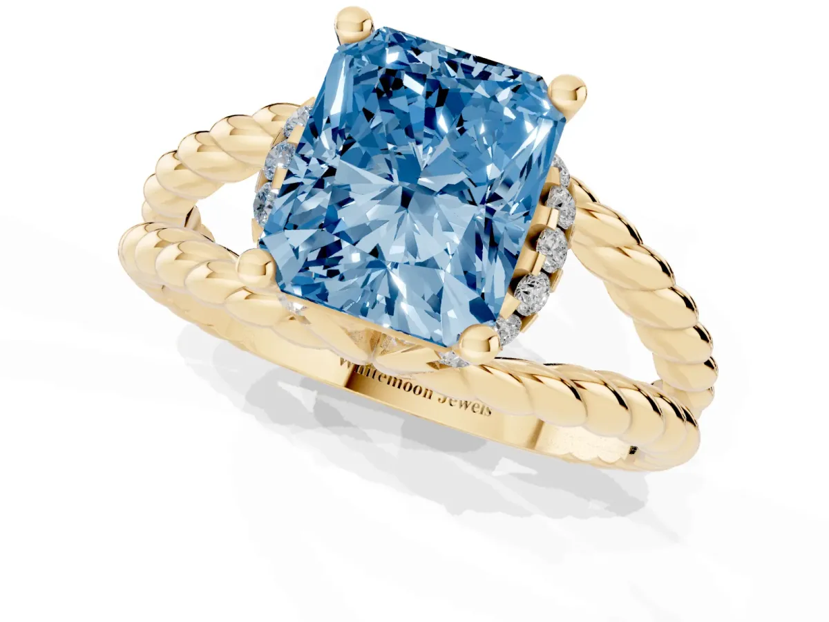Fancy Blue Radiant Cut Halo Twisted Band Four-Prong Ring Yellow gold