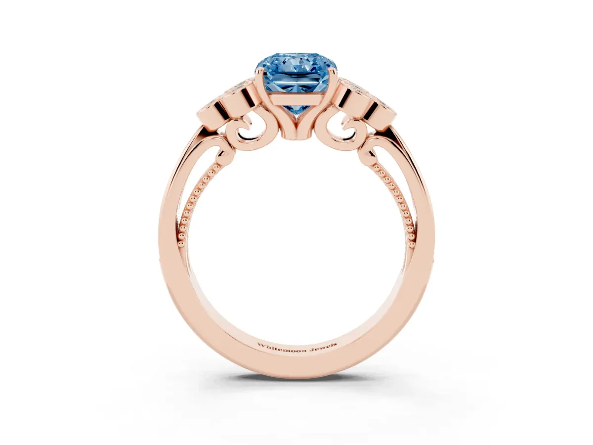Fancy Blue Radiant Cut Cut Diamond Engagement Ring with Bezel Set Round Side Stones and Prong Setting Rose gold