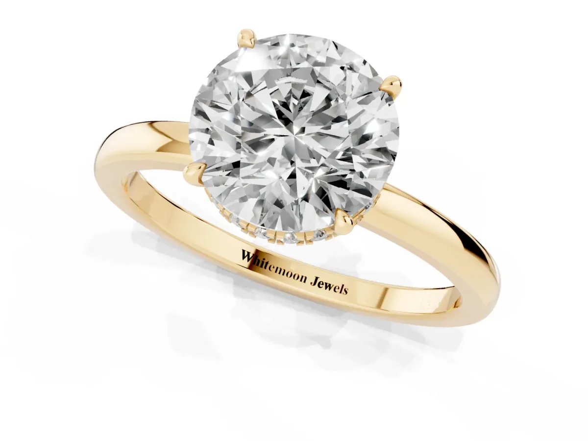 Round Cut Solitaire Engagement Ring with Cathedral Band and Four-Prong Setting Yellow gold