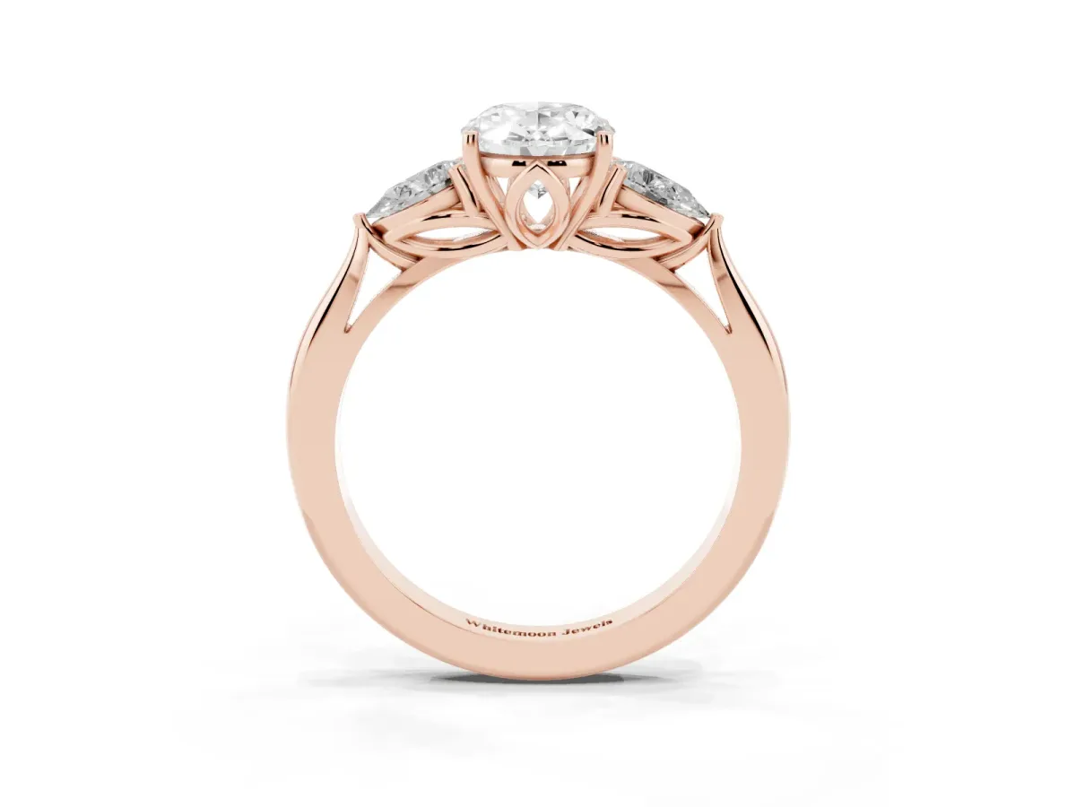 Three-Stone Oval Cut Diamond Ring with Pear Side Stones in Four-Prong Setting Rose gold