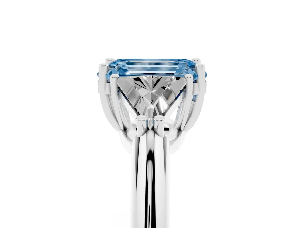 Fancy Blue Three-Stone Emerald Cut Diamond Engagement Ring with Trillion Side Stones and Prong Setting Silver