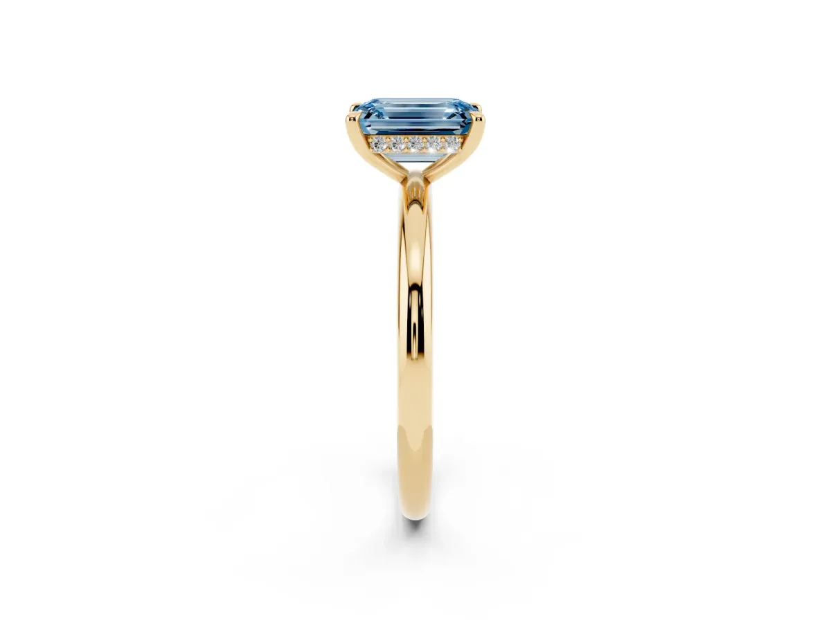 Fancy Blue Emerald Cut Diamond Solitaire Ring with Thin Band and Four-Prong Setting Yellow gold