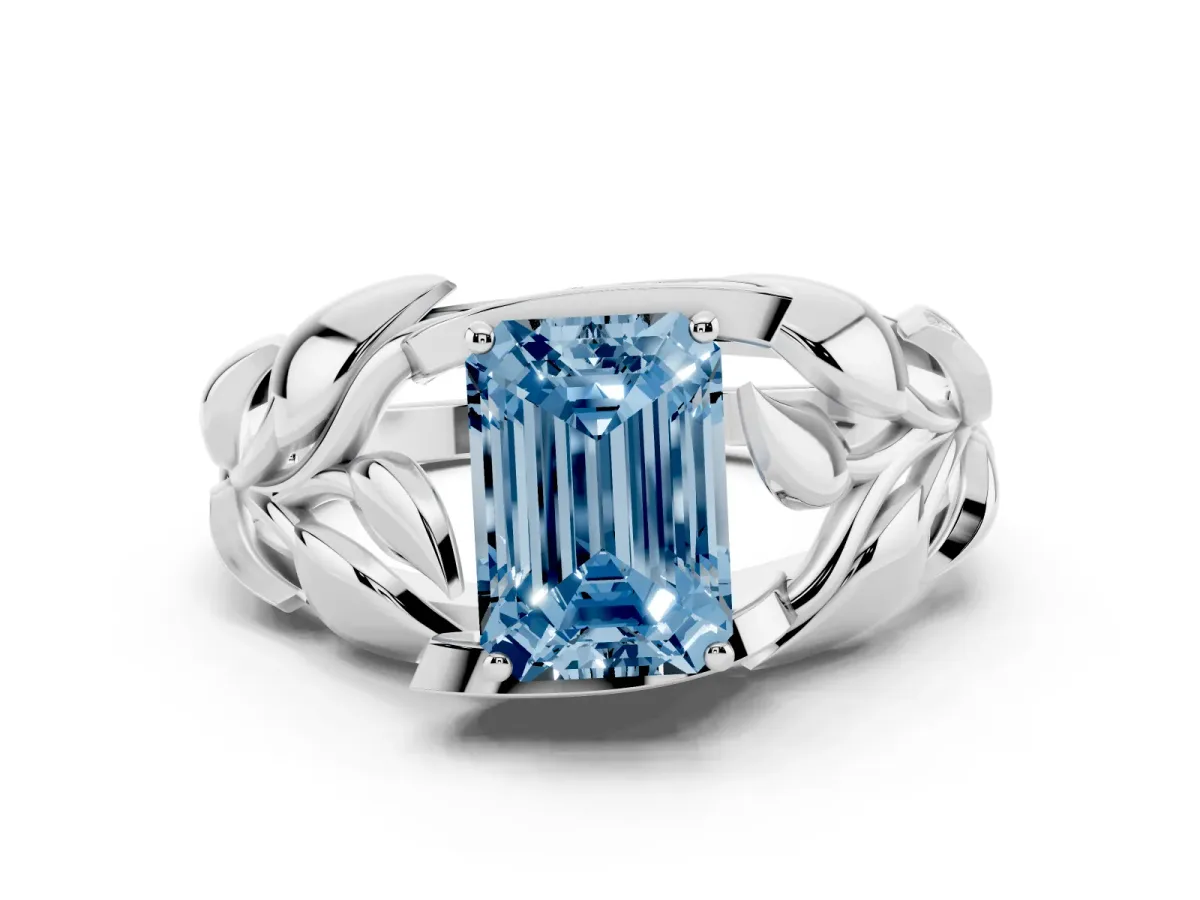 Fancy Blue Emerald Cut Diamond Leaf-Inspired Engagement Ring with Round Accents and Prong Setting Silver