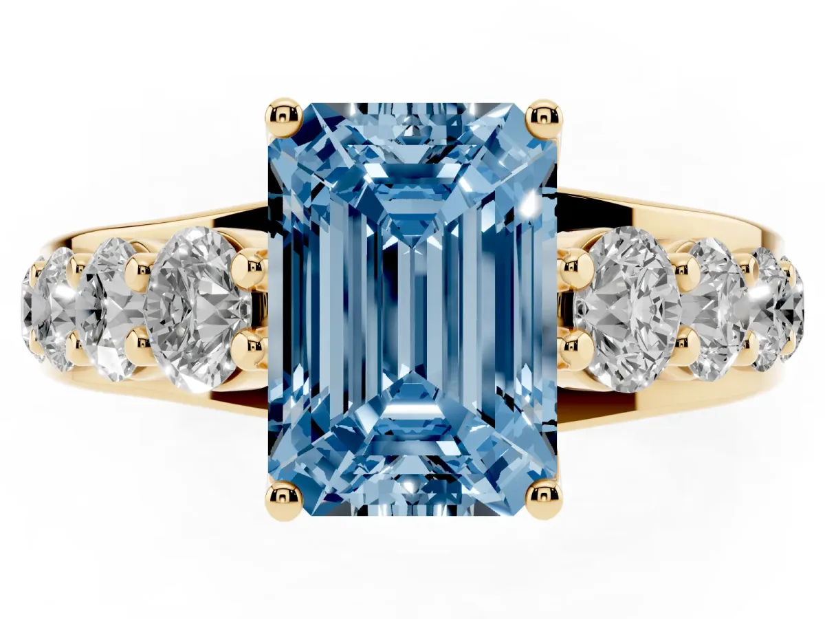 Fancy Blue Emerald Cut Diamond Engagement Ring with Pavé Band and Four-Prong Setting Yellow gold
