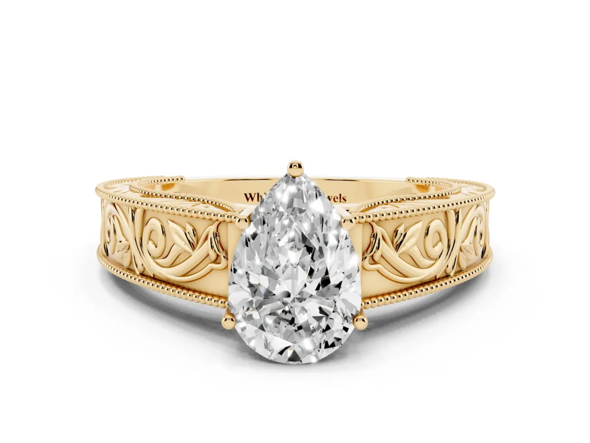 Pear Cut Diamond Solitaire Ring with Engraved Band and Four-Prong Setting Yellow gold