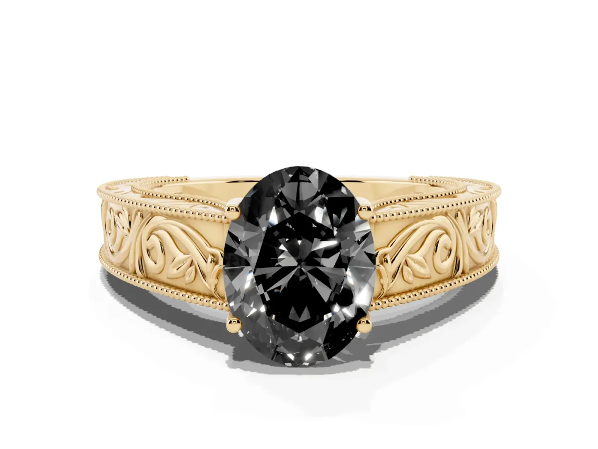 Fancy Black Oval Cut Diamond Solitaire Ring with Engraved Band and Four-Prong Setting Yellow gold