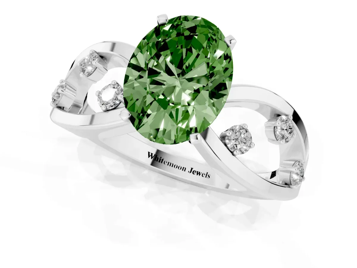 Fancy Green Oval Cut Cut Solitaire Diamond with Side Stones on Criss-Cross Band and Four-Prong Setting Silver