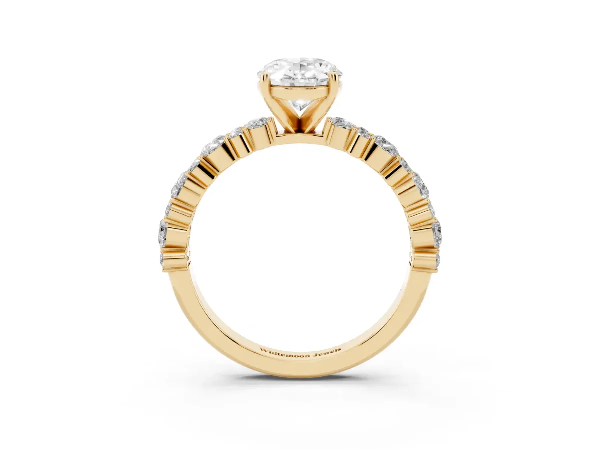Oval Cut Diamond Side Stone Solitaire Ring with Round and Four-Prong Setting Yellow gold