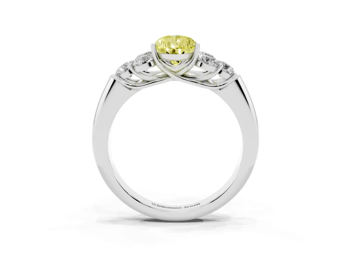 Fancy Yellow Pear Cut Cut Diamond Cluster Ring with Round Accent Stones and Prong Setting on a Classic Band Silver