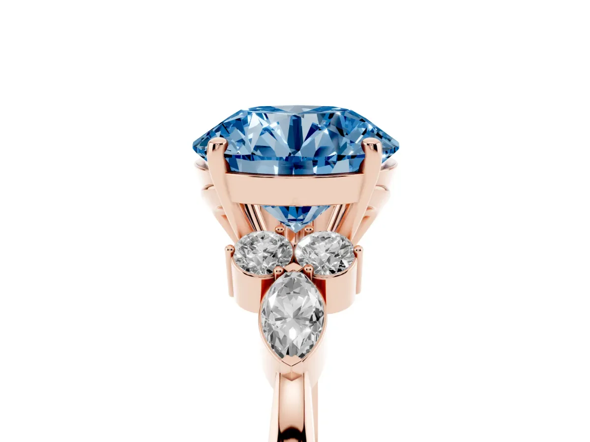 Fancy Blue Round Cut Brilliant Diamond Solitaire Ring with Pear Side Stones and Four-Prong Setting Rose gold
