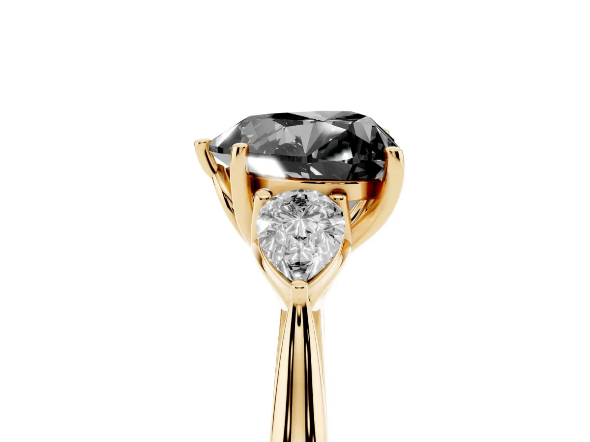 Fancy Black Three-Stone Heart Cut Brilliant Diamond Solitaire Ring with Tapered Band and Four-Prong Setting Yellow gold