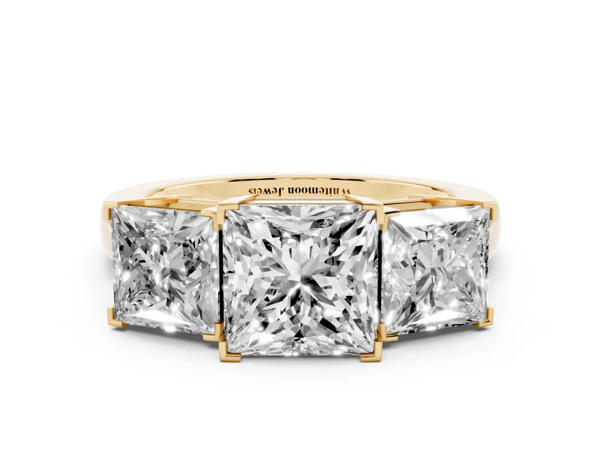 Three-Stone Princess Cut Cut Diamond Ring with Channel Set Band and Four-Prong Setting Yellow gold