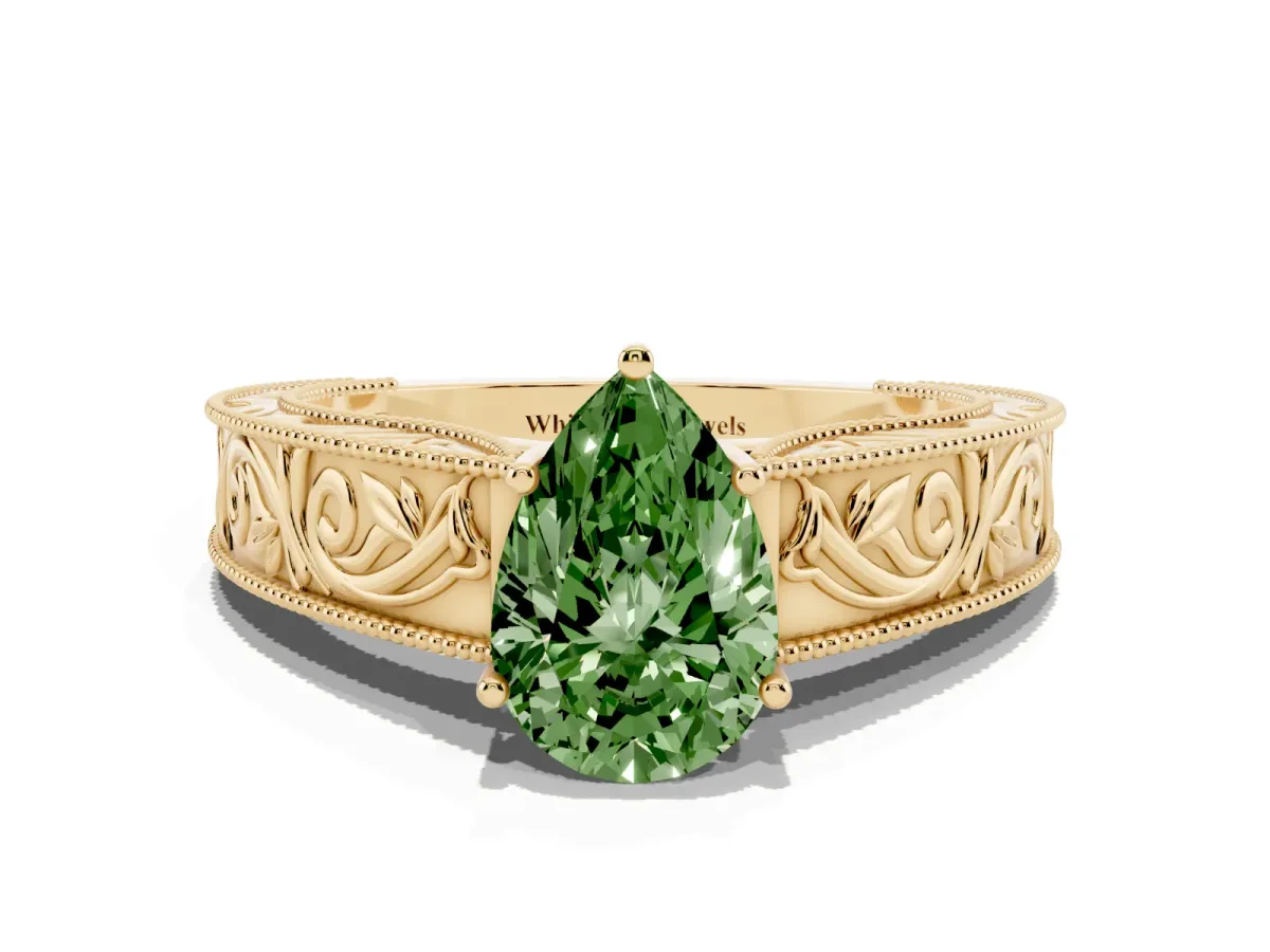 Fancy Green Pear Cut Diamond Solitaire Ring with Engraved Band and Four-Prong Setting Yellow gold