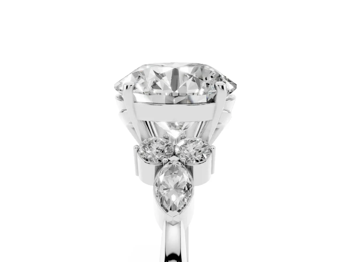 Round Cut Brilliant Diamond Solitaire Ring with Pear Side Stones and Four-Prong Setting Silver