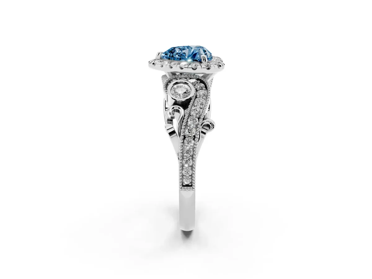 Fancy Blue Heart Cut Halo Diamond Ring with Milgrain and Bezel Accents on a Split Shank Band Platinum