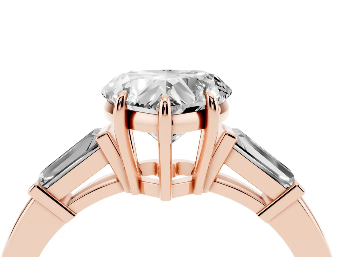 Heart Cut Diamond Three-Stone Ring with Tapered Baguette Side Stones and Prong Setting Rose gold