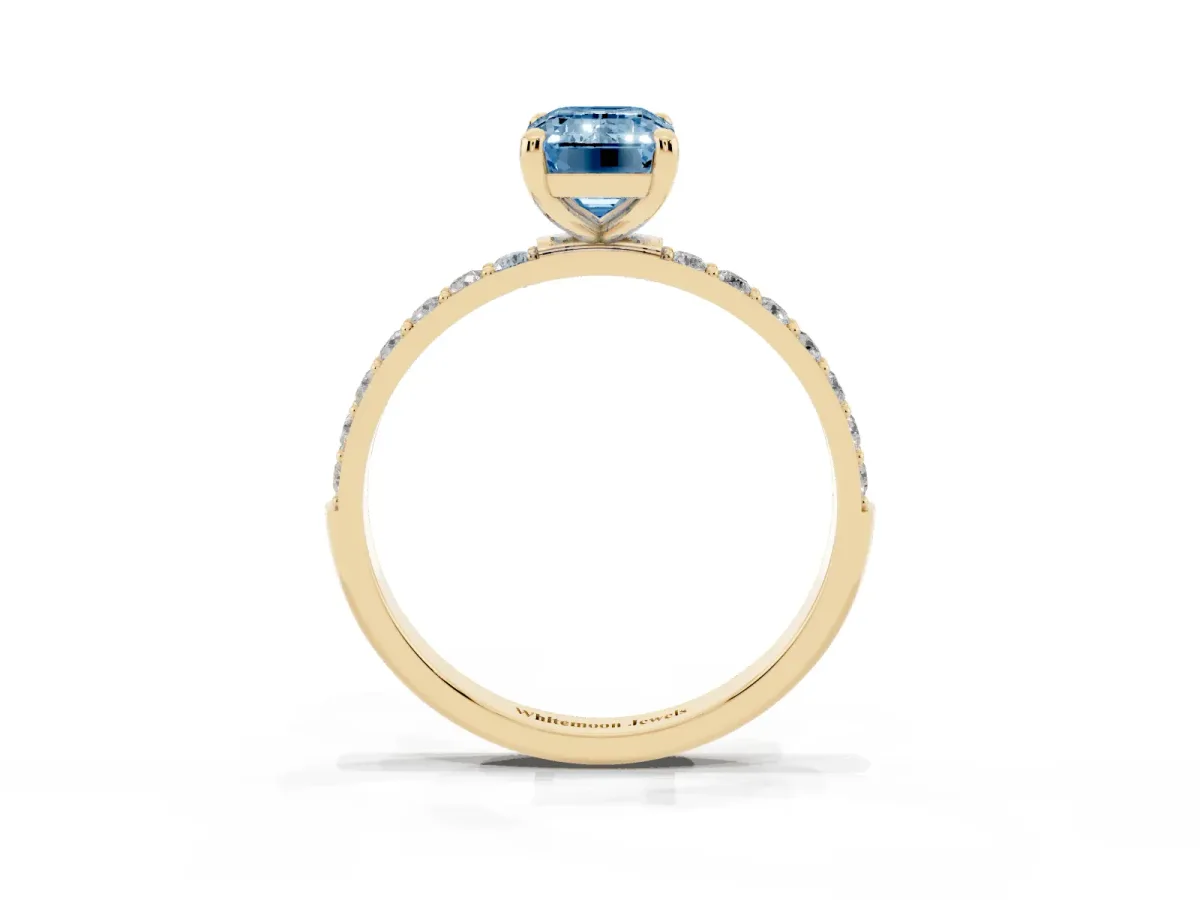 Fancy Blue Emerald Cut Diamond Solitaire Ring with Round Pavé Band and Prong Setting Yellow gold