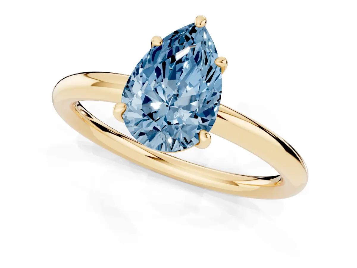 Fancy Blue Pear Cut Solitaire Diamond Ring with Four-Prong Setting on a Plain Band Yellow gold