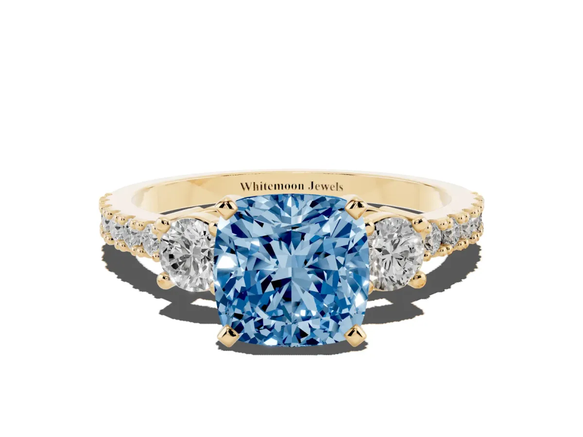 Fancy Blue Cushion Cut Three-Stone Diamond Pavé Band with Prong Setting Yellow gold
