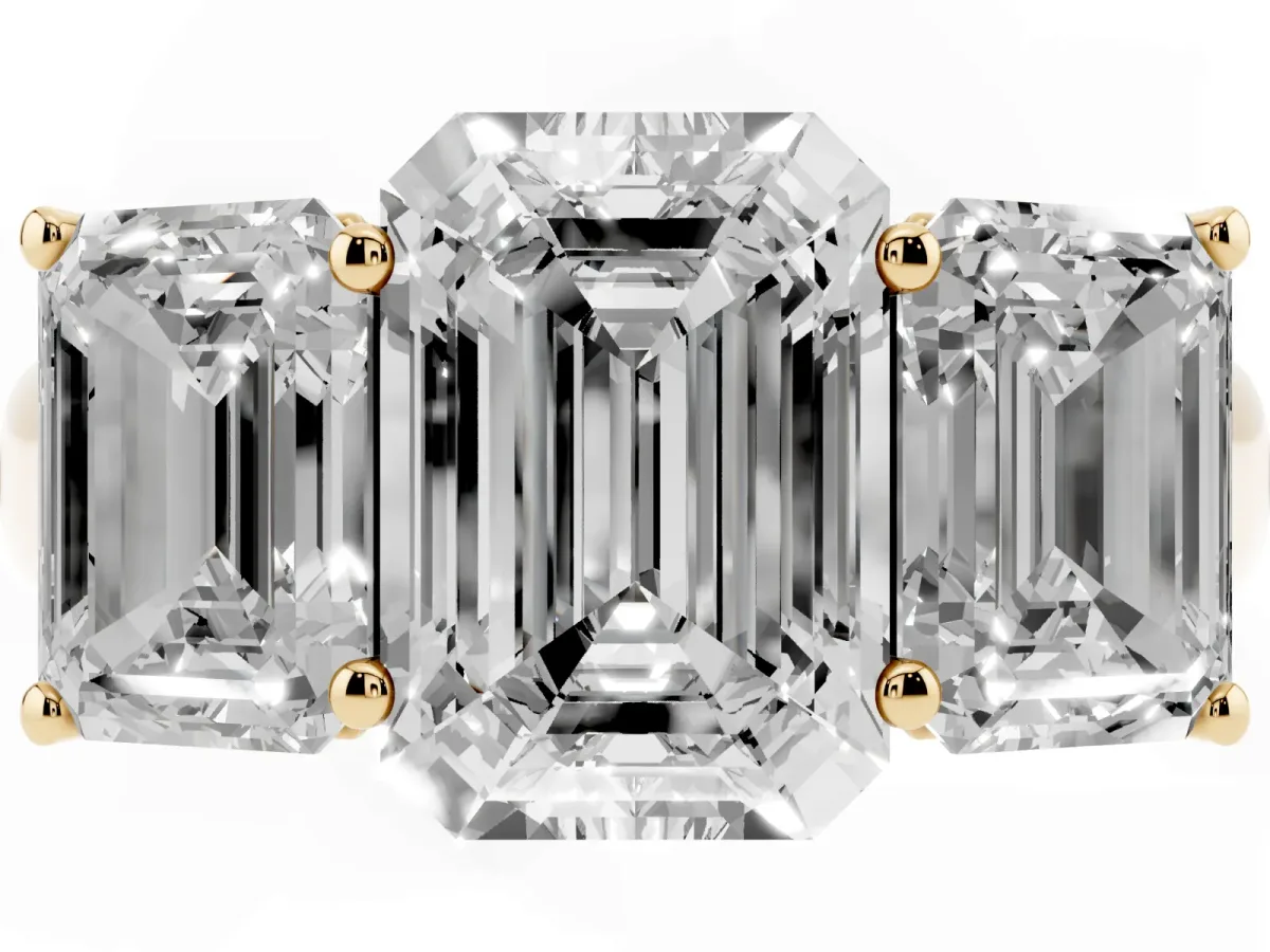 Emerald Cut Three-Stone Diamond Ring with Prong Setting on a Classic Band Yellow gold