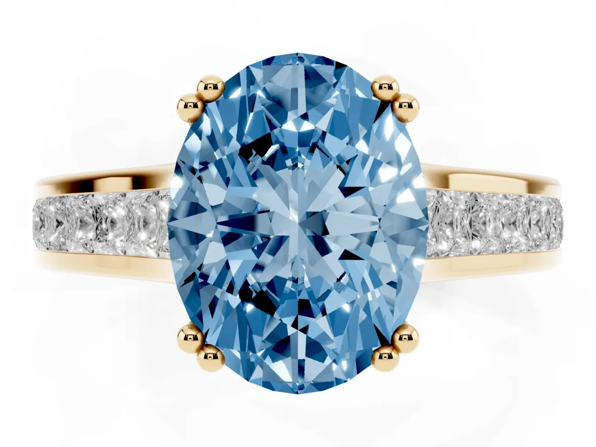 Fancy Blue Oval Cut Cut Channel Set Solitaire Engagement Ring with Prong Setting Yellow gold
