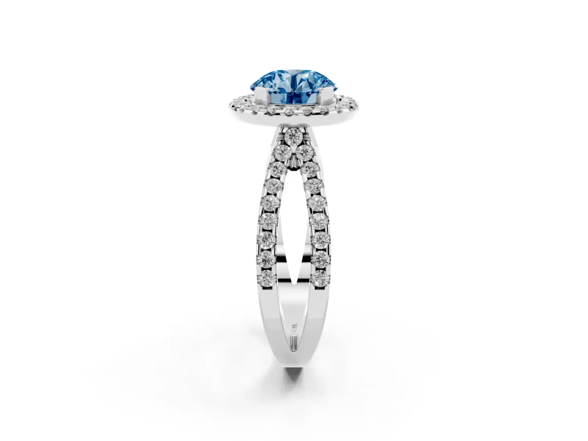 Fancy Blue Round Cut Diamond Halo Ring with Split Shank Pavé Band and Prong Setting Silver