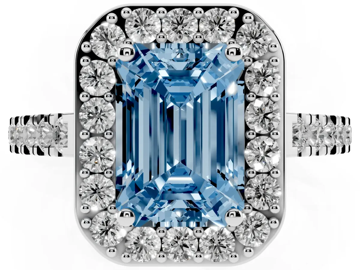 Fancy Blue Emerald Cut Diamond Halo Ring with Round Pavé Split Shank and Prong Setting Platinum