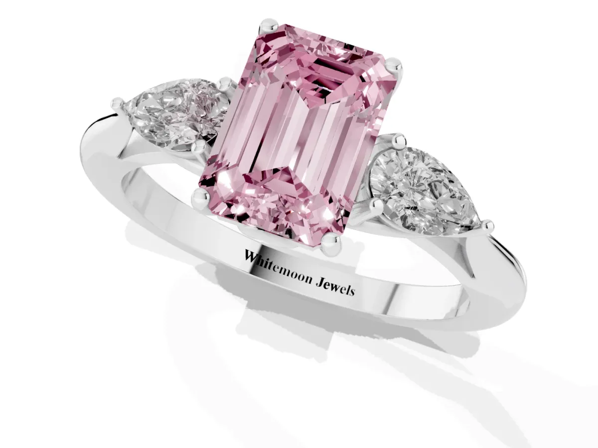 Fancy Pink Three-Stone Emerald Cut Diamond Ring with Pear Side Stones in Four-Prong Setting Platinum