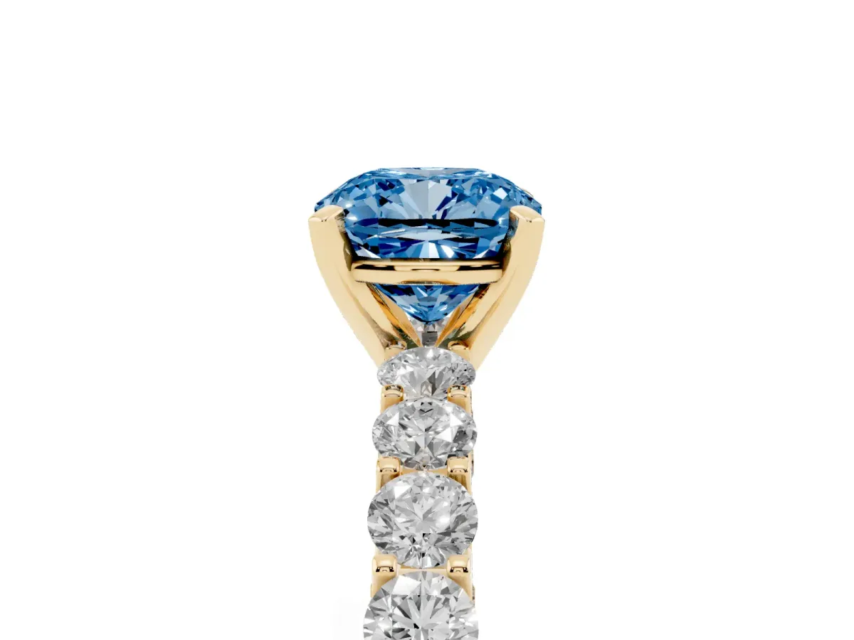 Fancy Blue Cushion Cut Diamond Solitaire Ring with Shared Prong Pavé Band and Four-Prong Setting Yellow gold