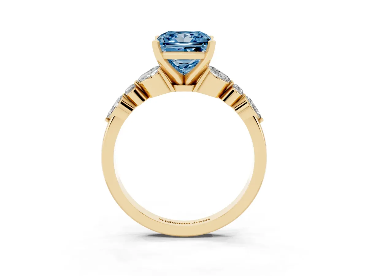 Fancy Blue Princess Cut Diamond Solitaire Ring with Side Stones and Four-Prong Setting Yellow gold