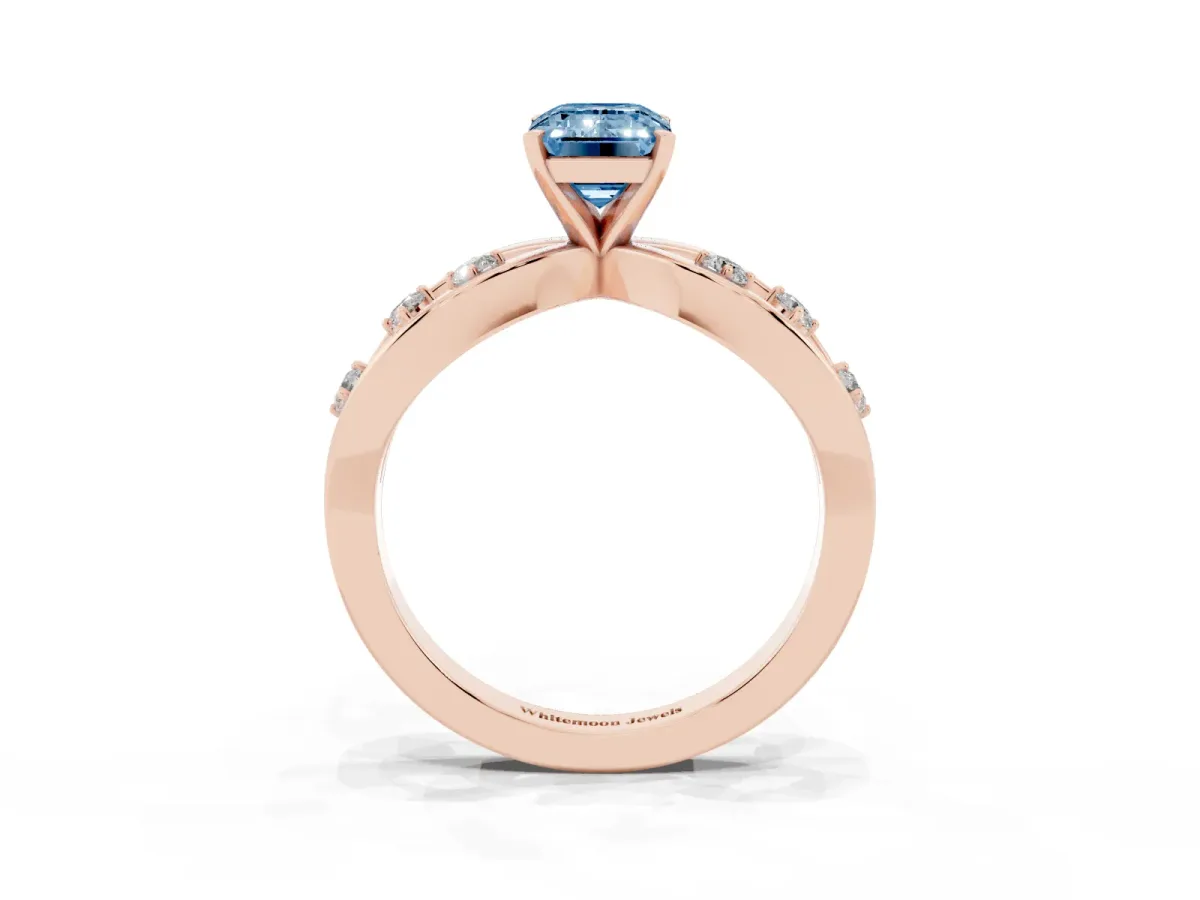Fancy Blue Emerald Cut Cut Solitaire Diamond with Side Stones on Criss-Cross Band and Four-Prong Setting Rose gold