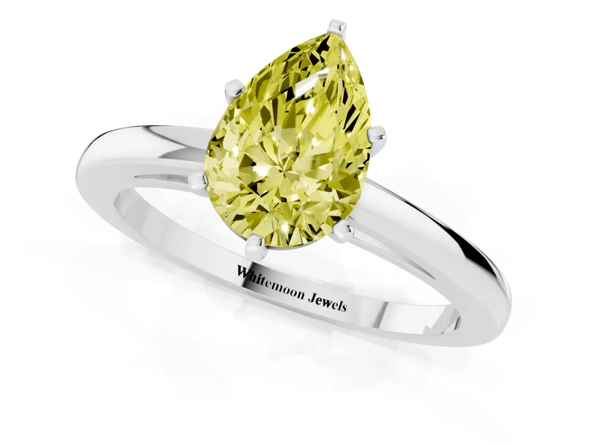 Fancy Yellow Pear Cut Solitaire Diamond Engagement Ring with Four-Prong Setting on a Classic Band White gold