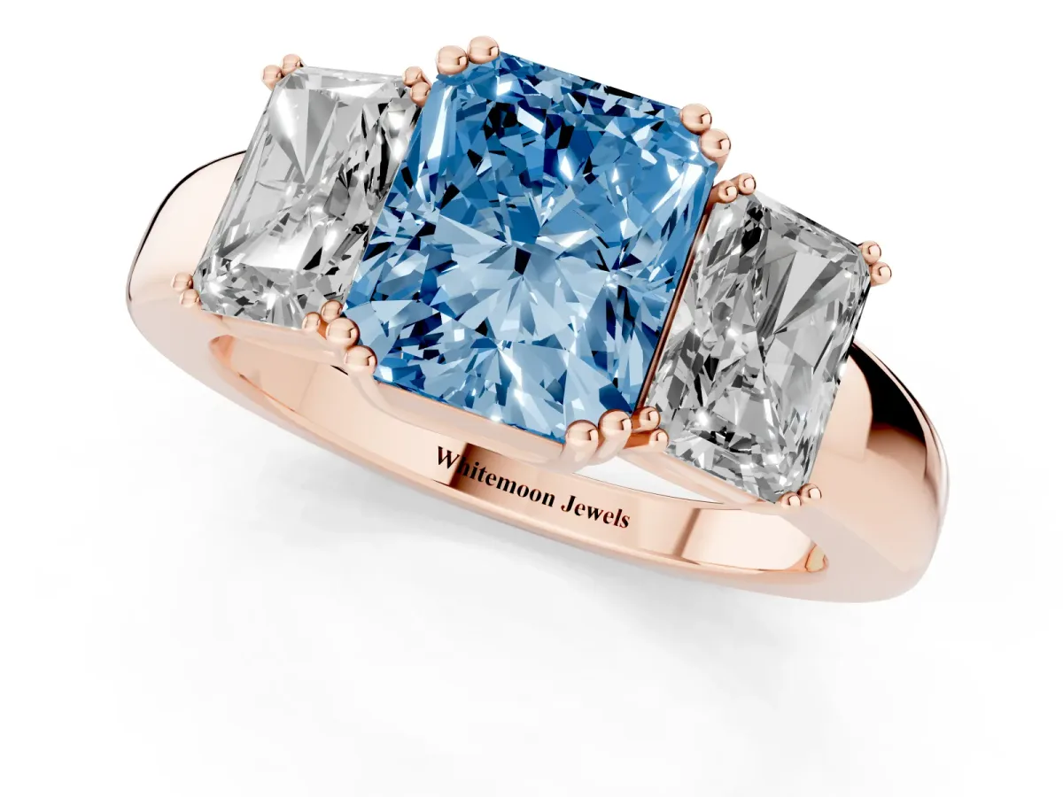 Fancy Blue Three-Stone Radiant Cut Cut Diamond Ring with Channel Set Band and Four-Prong Setting Rose gold