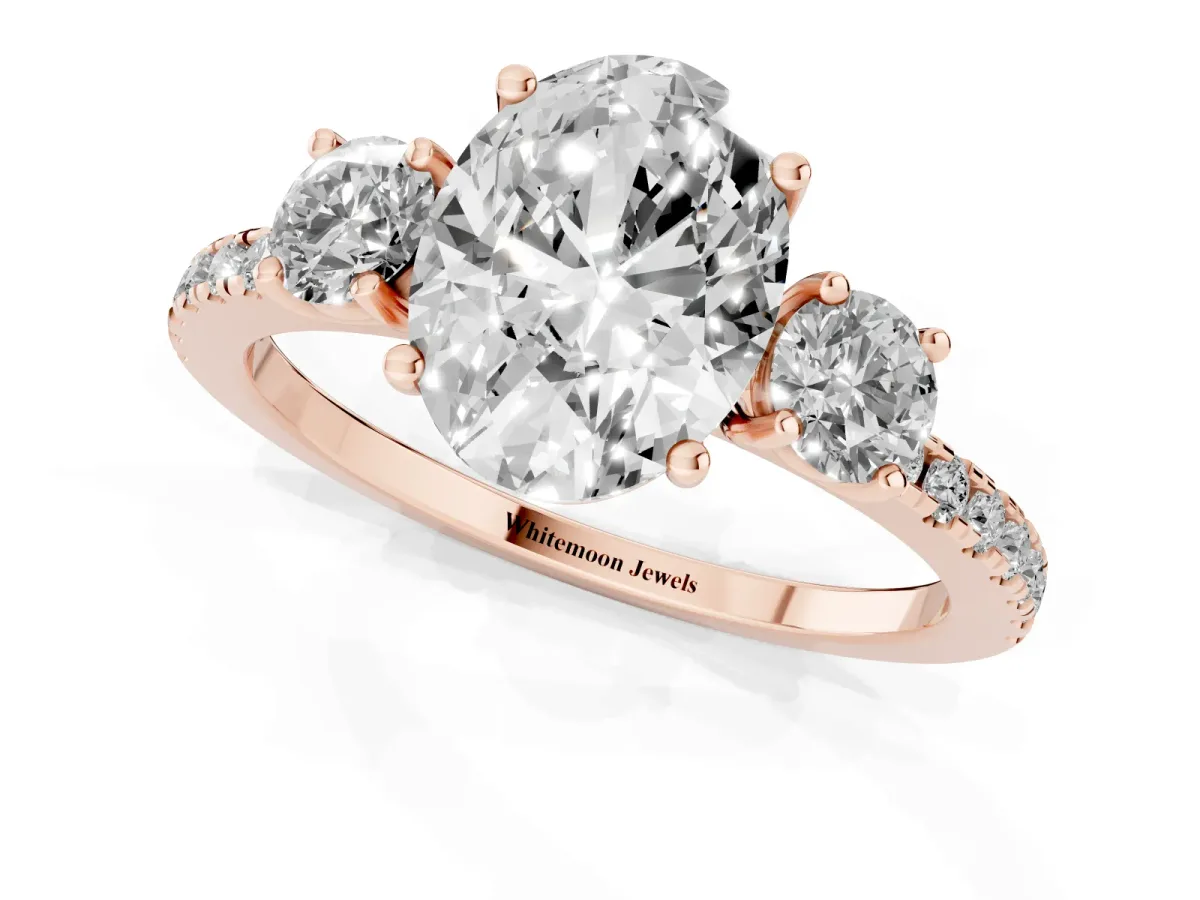 Three-Stone Oval Cut Cut Diamond Pavé Band with Prong Setting Rose gold