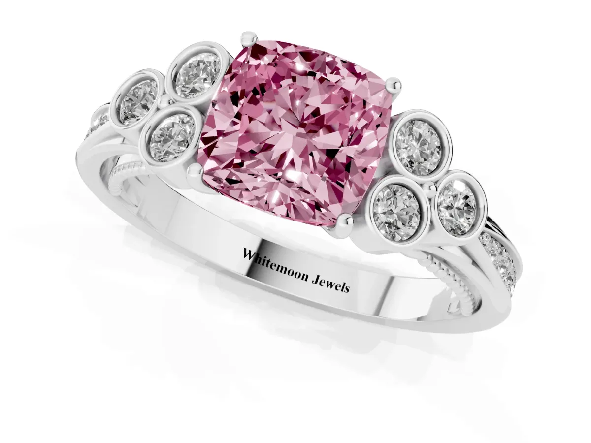Fancy Pink Cushion Cut Cut Diamond Engagement Ring with Bezel Set Round Side Stones and Prong Setting Platinum