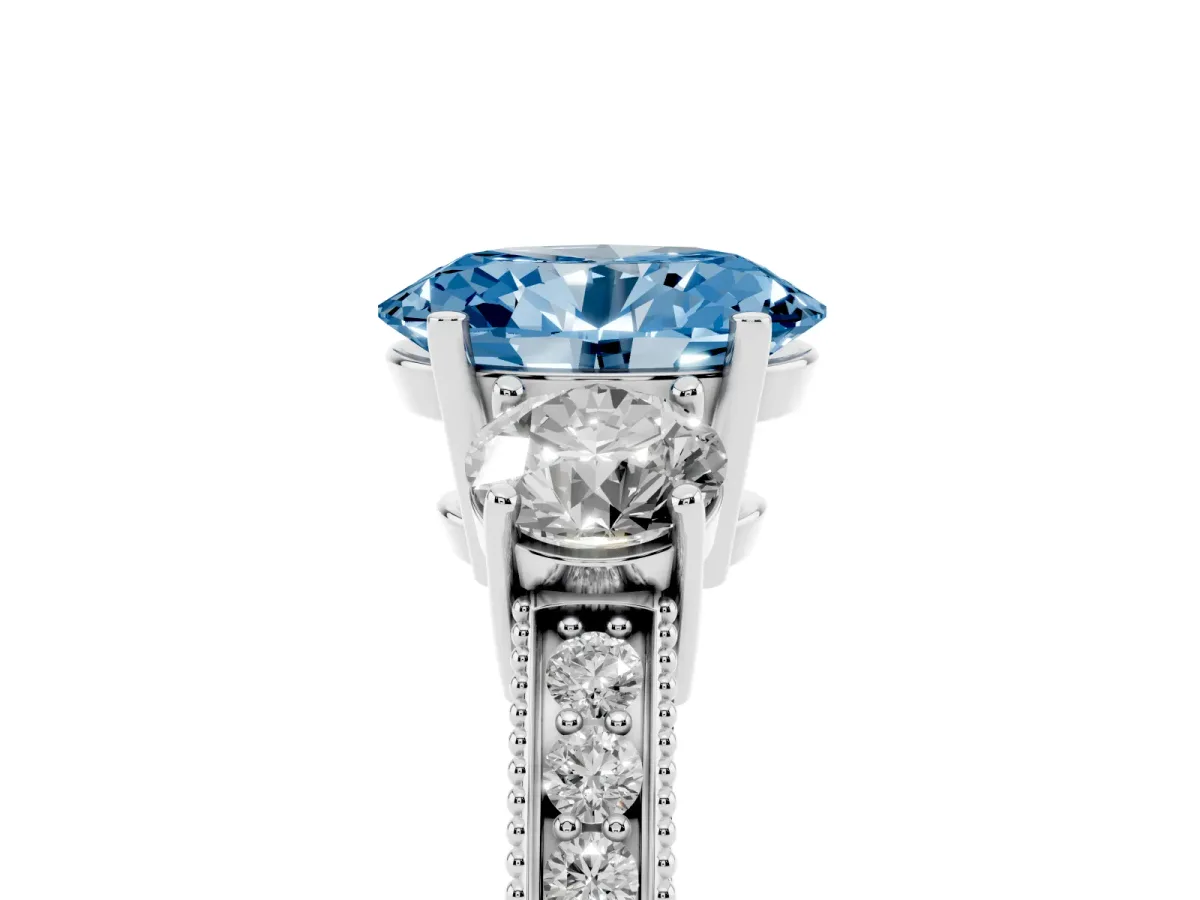 Fancy Blue Oval Cut Three-Stone Diamond Ring with Pavé Band and Four-Prong Setting Platinum