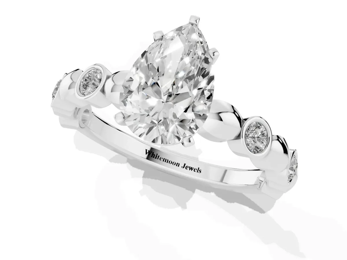 Pear Cut Solitaire Bezel-Set Diamond Ring with Beaded Band and Four-Prong Setting Silver