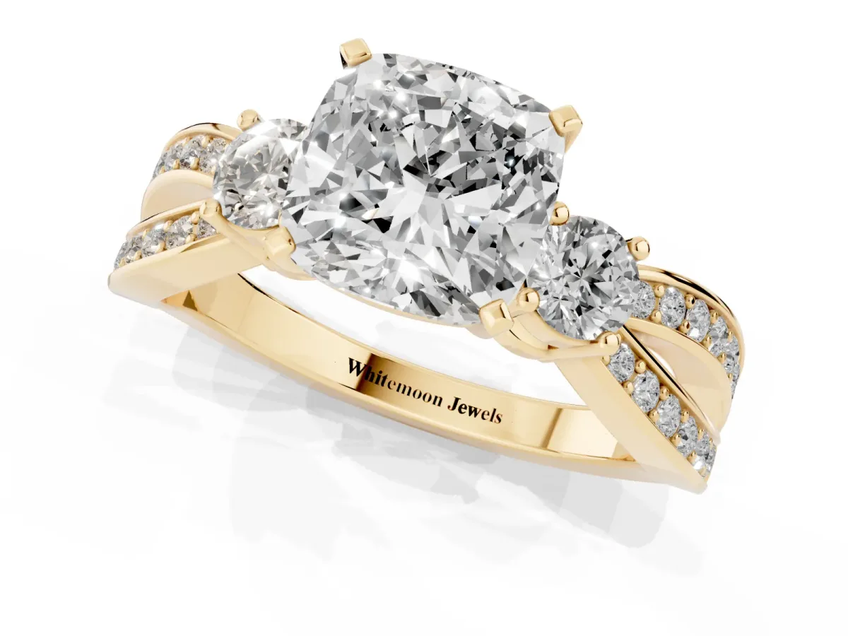 Three-Stone Cushion Cut Cut Diamond Twist Band with Prong Setting Yellow gold