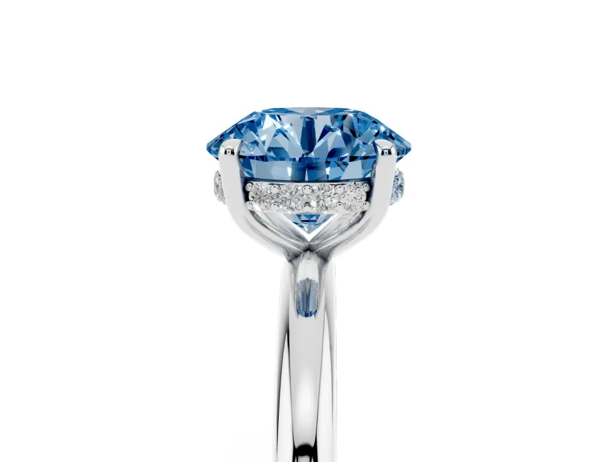 Fancy Blue Round Cut Diamond Solitaire Ring with Thin Band and Four-Prong Setting Silver