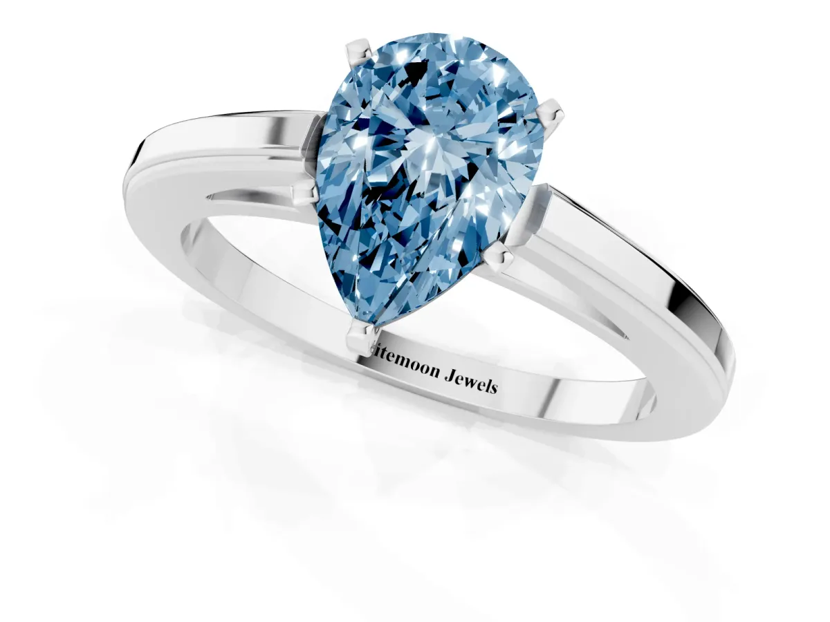 Fancy Blue Pear Cut Solitaire Diamond Ring with Four-Prong Setting and Classic Band White gold