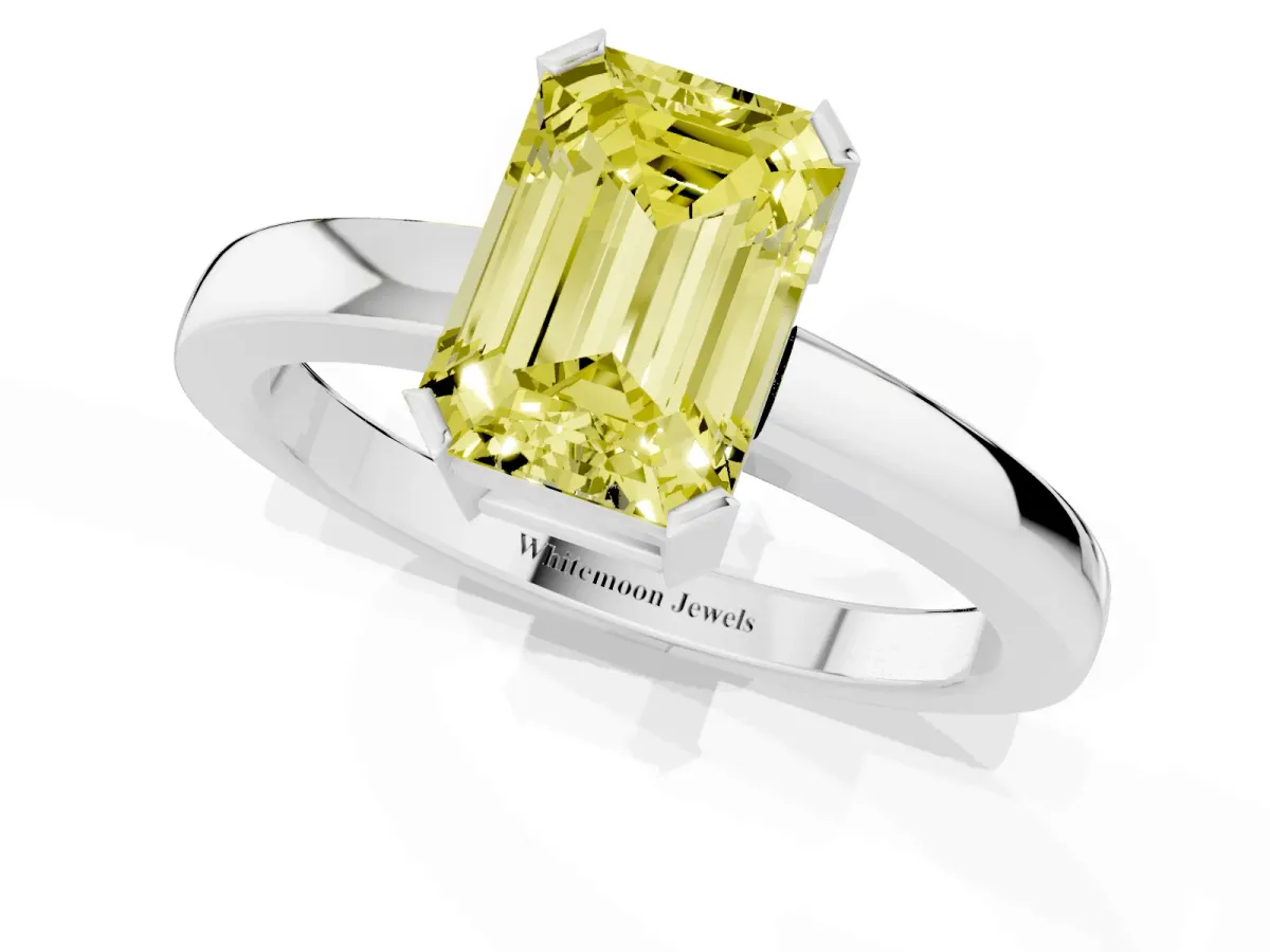 Fancy Yellow Emerald Cut Cut Solitaire Ring with Four-Prong Setting and Classic Band Silver