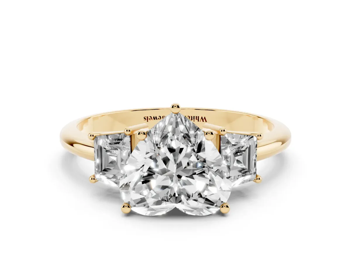 Heart Cut Diamond Three-Stone Ring with Trapezoid Side Stones and Prong Setting Yellow gold