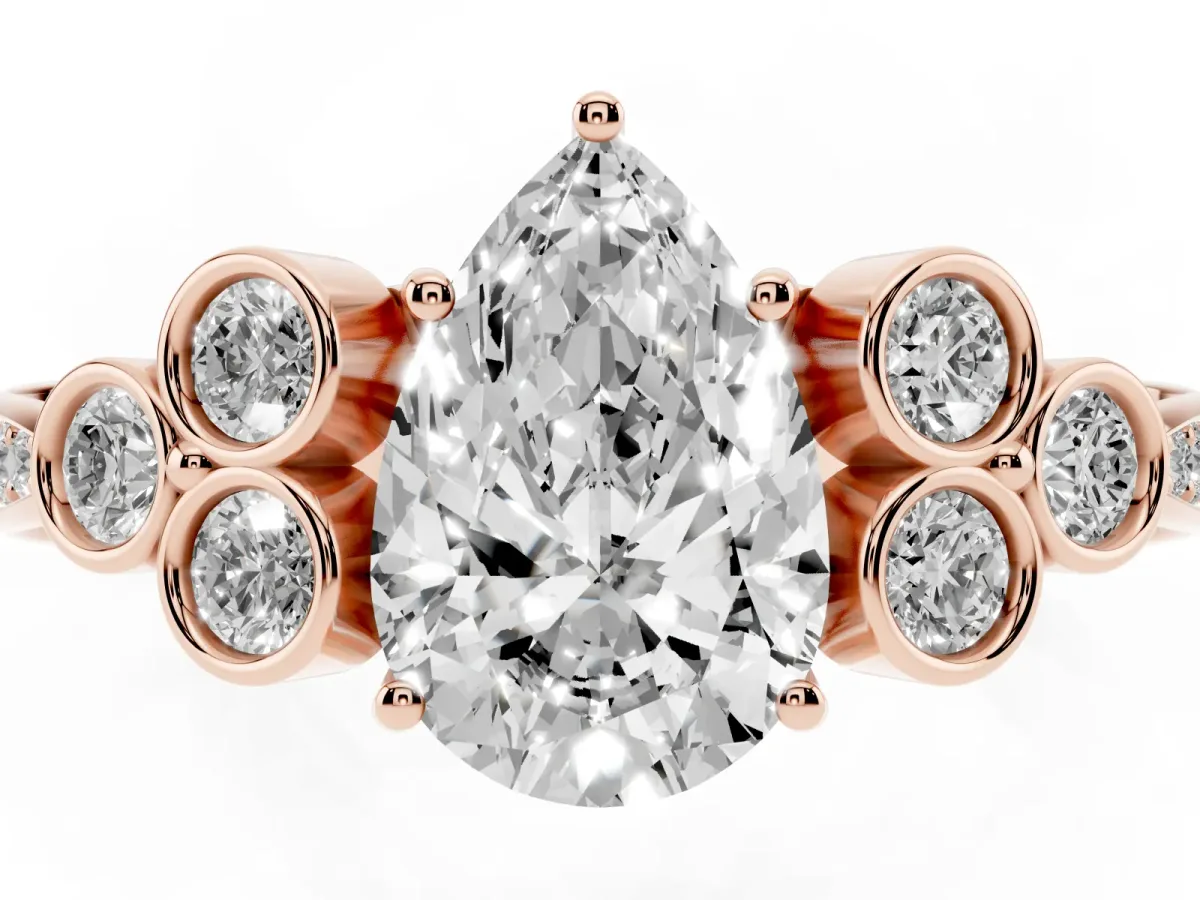 Pear Cut Cut Diamond Engagement Ring with Bezel Set Round Side Stones and Prong Setting Rose gold