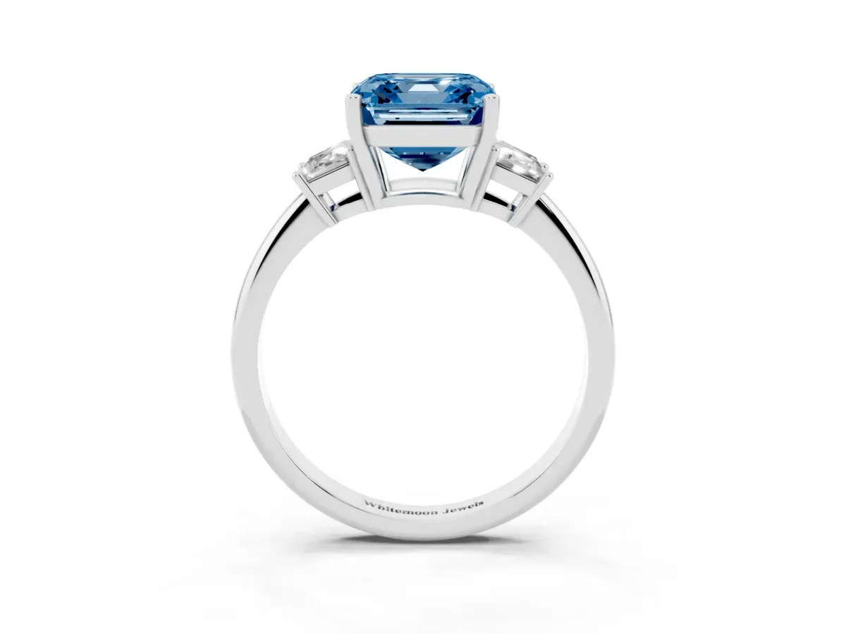 Fancy Blue Asscher Cut Diamond Three-Stone Ring with Trapezoid Side Stones and Prong Setting Platinum