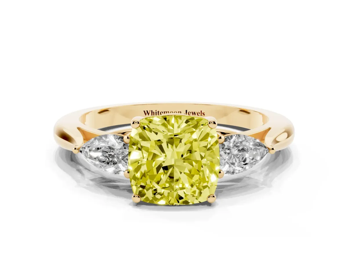 Fancy Yellow Three-Stone Cushion Cut Diamond Ring with Pear Side Stones in Four-Prong Setting Yellow gold