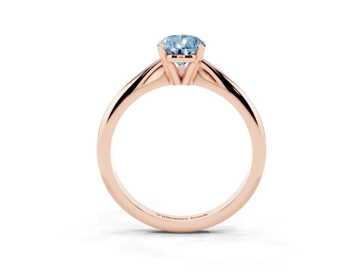 Fancy Blue Pear Cut Cut Solitaire Ring with Four-Prong Setting on a Classic Band Rose gold