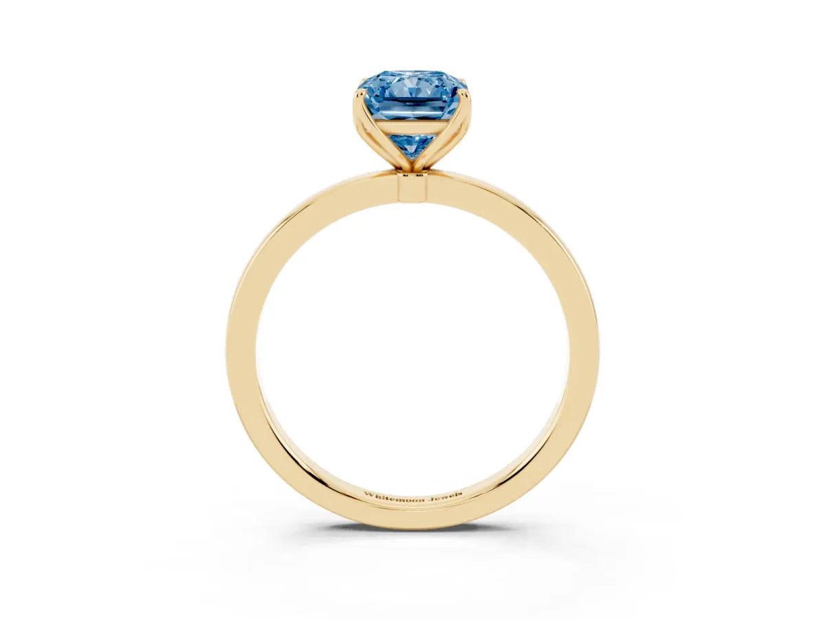Fancy Blue Radiant Cut Diamond Solitaire Ring with Thin Band and Prong Setting Yellow gold