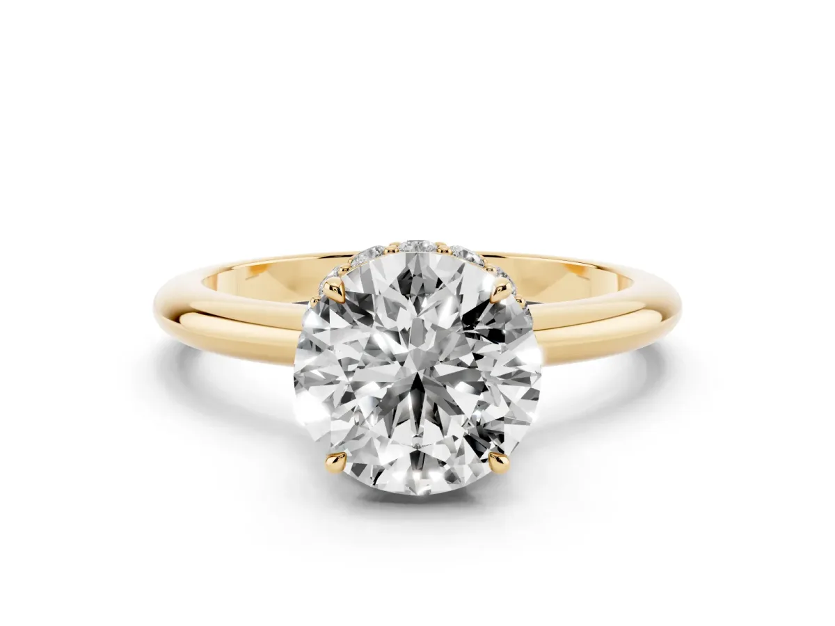 Round Cut Brilliant Solitaire Engagement Ring with Six-Prong Setting and Classic Band Yellow gold