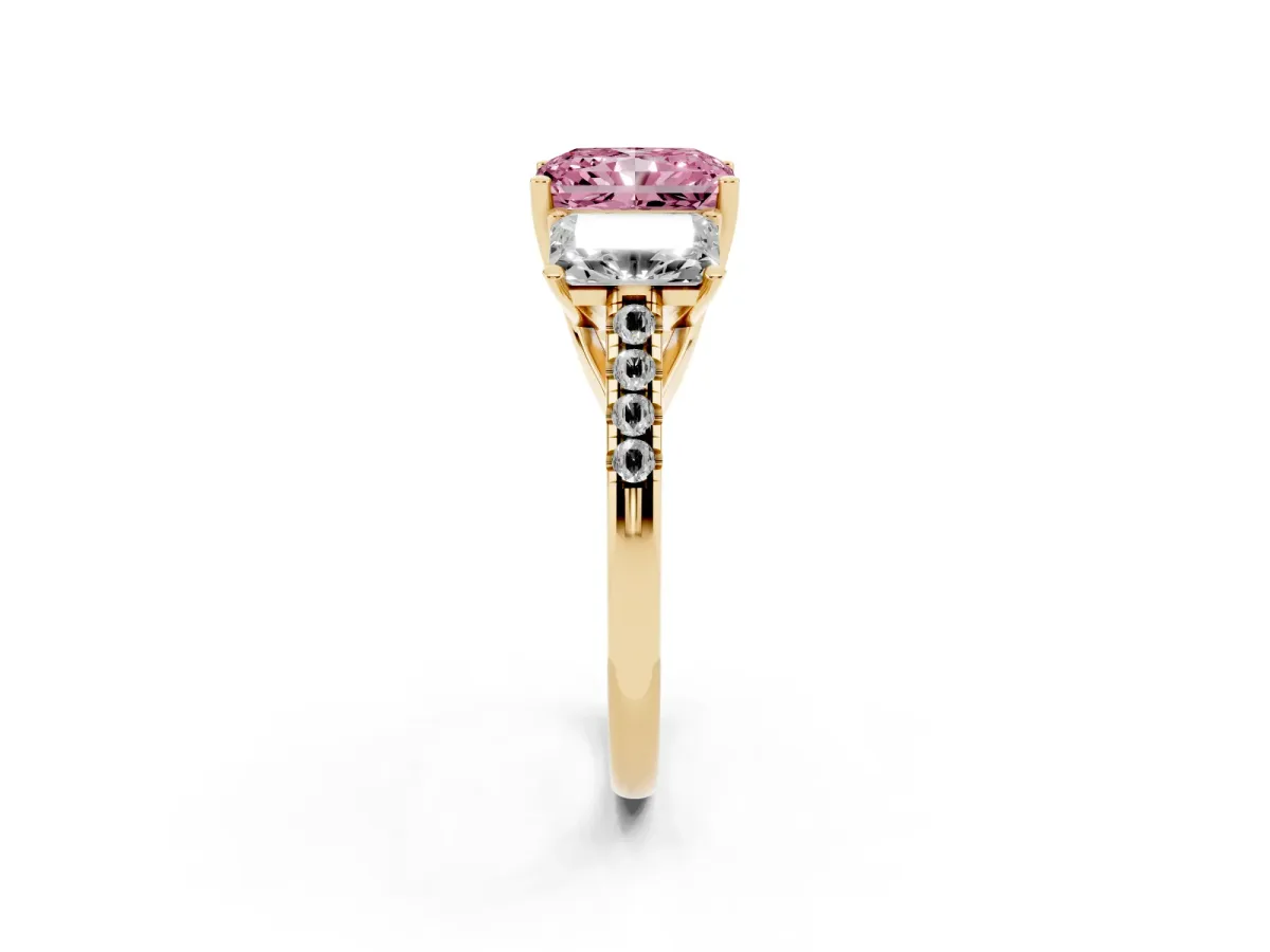 Fancy Pink Three-Stone Radiant Cut Diamond Ring with Round Pavé Band and Prong Setting Yellow gold