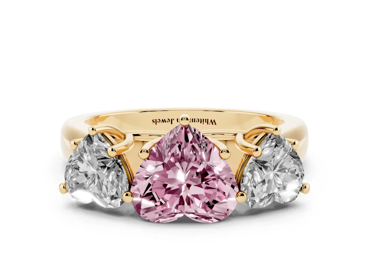 Fancy Pink Heart Cut Three-Stone Diamond Ring with Prong Setting on a Classic Band Yellow gold